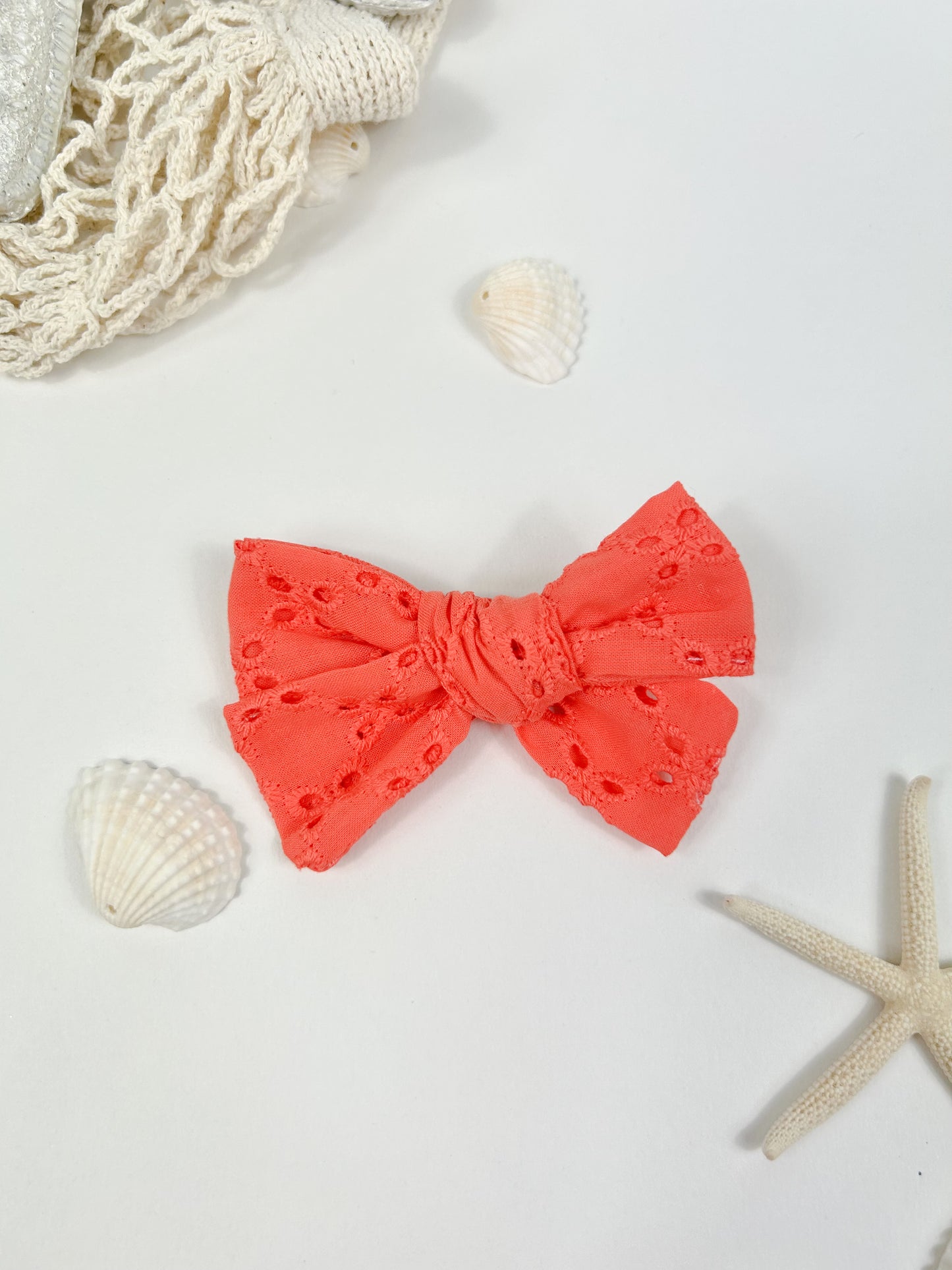 Coral hair bow